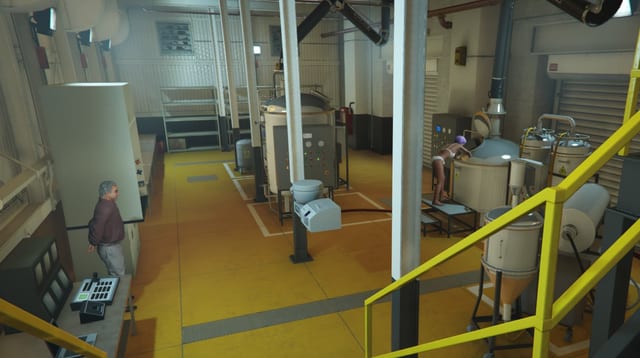 Meth lab interior with a worker leaning over a cooking vessel and a man standing at a control desk.
