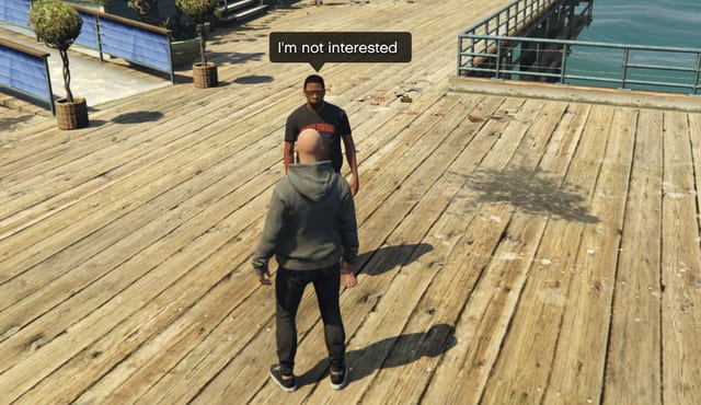 NPC on a pier with the speech bubble "I'm not interested" facing the player.