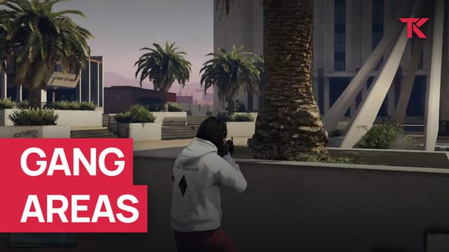 Masked player in a white hoodie aiming a rifle across a plaza with palm trees.