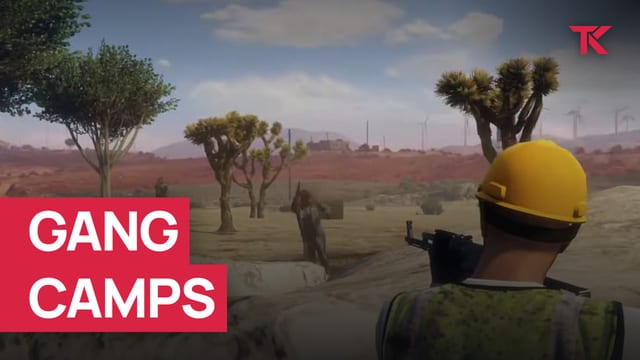 Player in a yellow hard hat aiming a rifle at an armed figure among Joshua trees in the desert.