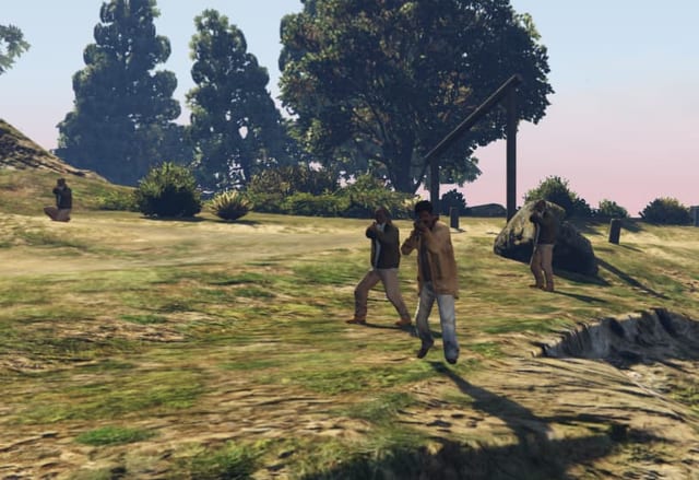 Three armed NPCs in a grassy field aiming weapons.