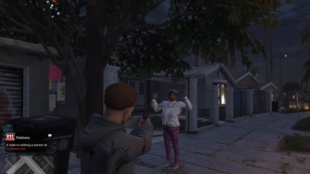 Player aiming a pistol at a woman with raised hands on a street at night, with an "Intimidate the person" bar and a 911 Robbery notice.