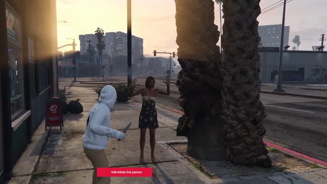 Player in a white hoodie holding a knife towards a woman in a floral dress with raised hands, on a pavement outside a supermarket at sunset, above an "Intimidate the person" bar.