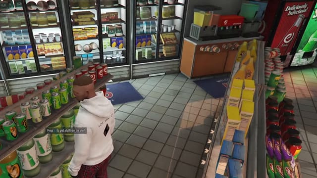 Player in a white hoodie at a shop shelf of drink cans with the prompt "Press E to grab stuff from the shelf", between fridges and a snack aisle.