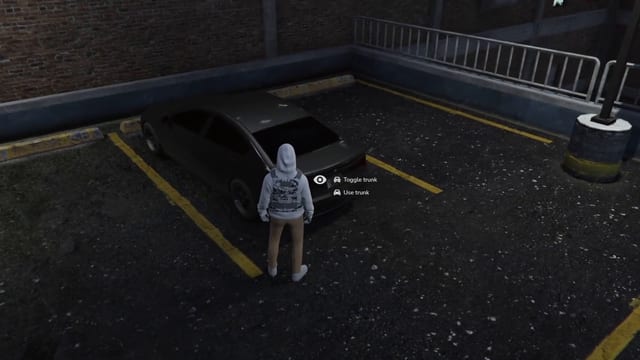 Player standing behind a parked car in a parking garage, with an eye icon and the options Toggle trunk and Use trunk beside the car's trunk.