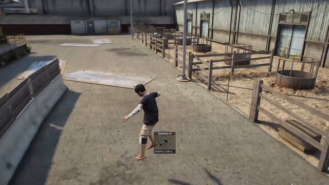 Player in a dusty ranch yard with wooden fences and pens, beside an item notification showing a grapple gun.